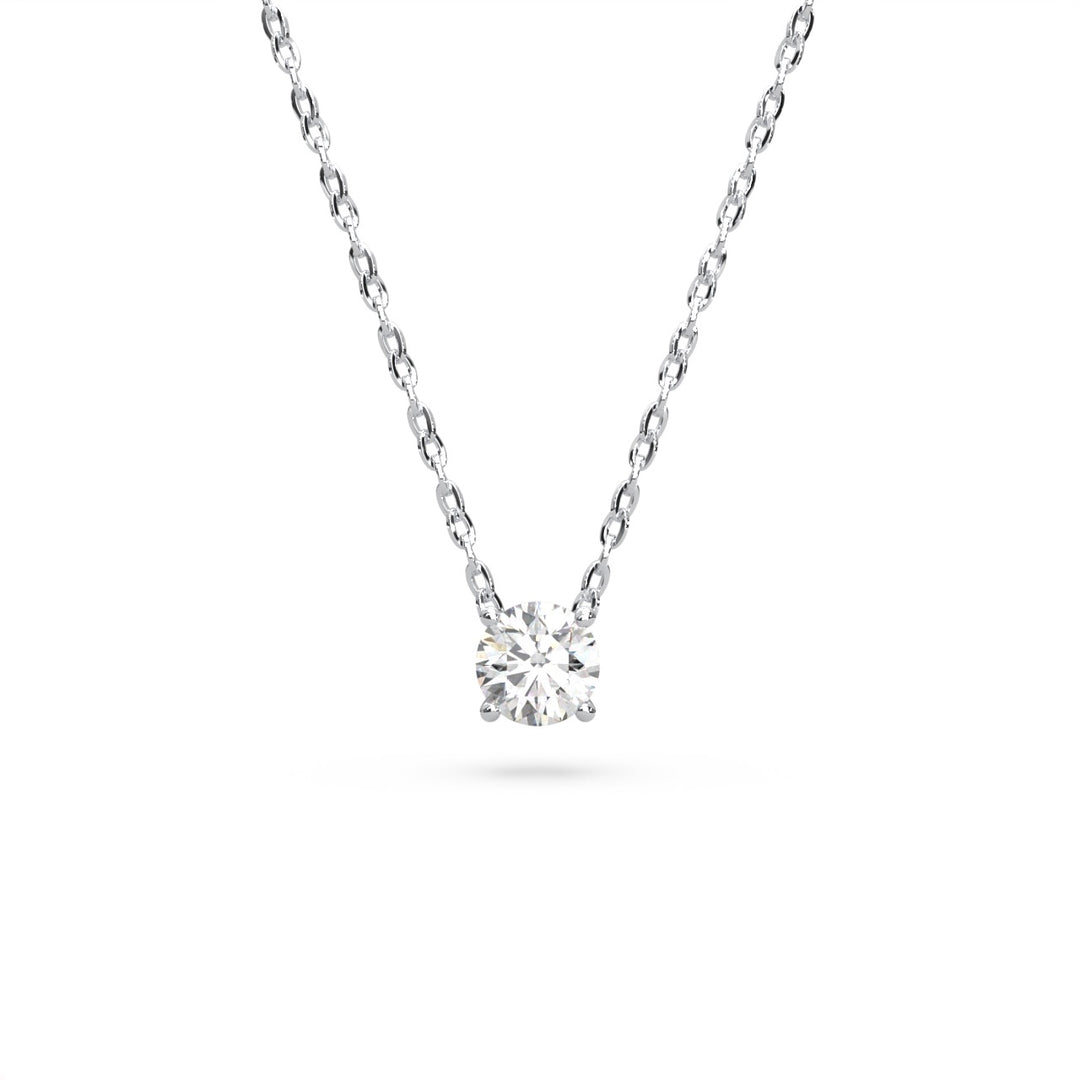 A delicate silver necklace with a single large, brilliant-cut diamond pendant.