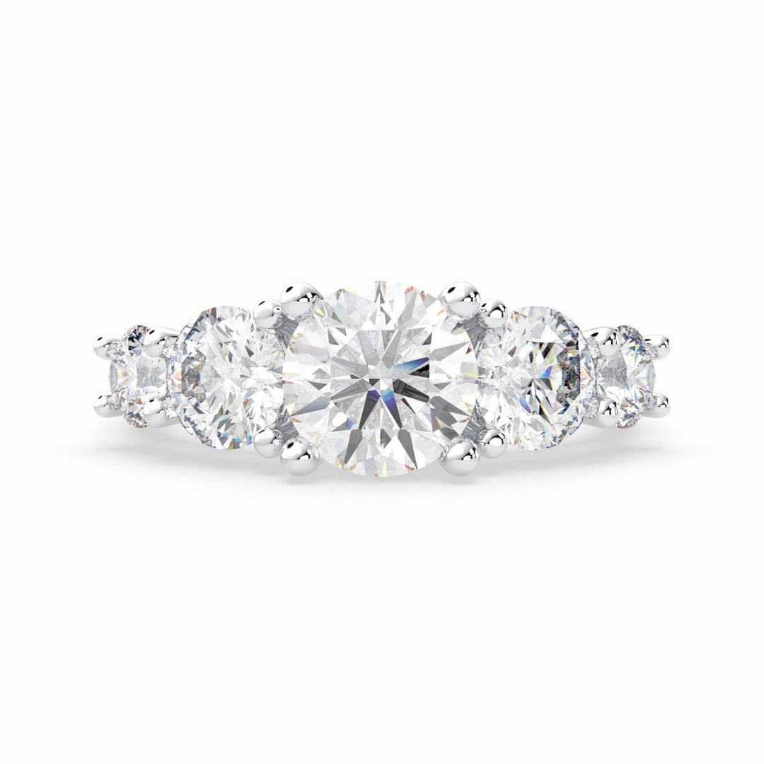 a three stone engagement ring with three diamonds