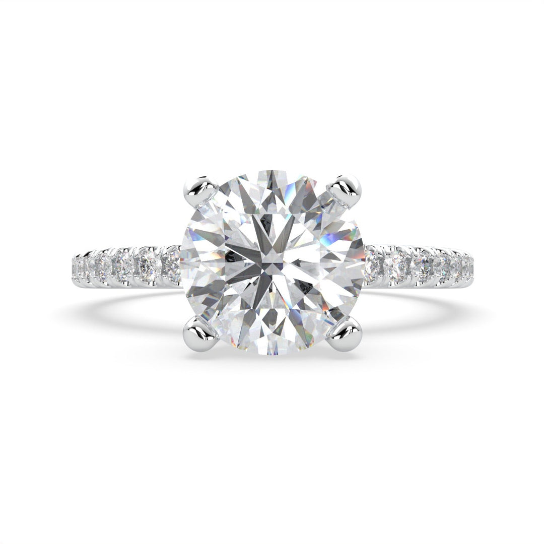a diamond engagement ring with a side stones