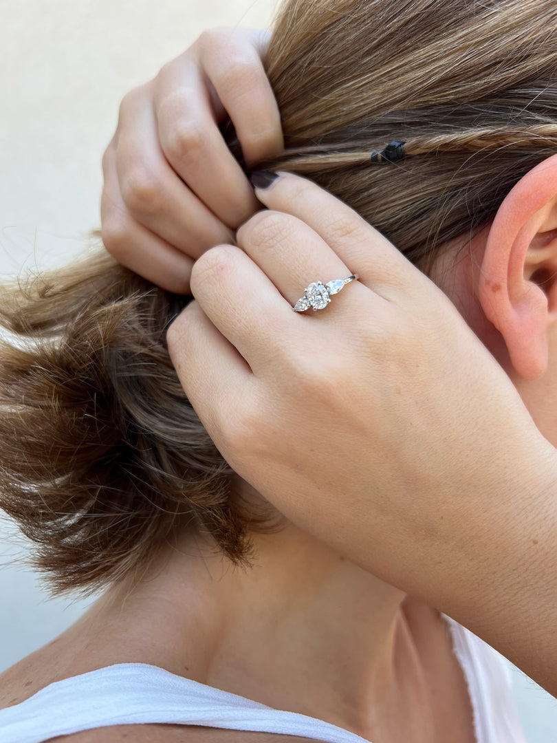 a close up of a person wearing a ring