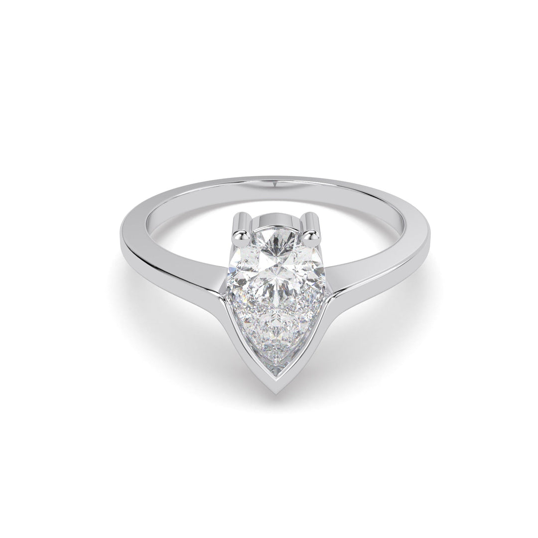 a white gold ring with a pear shaped diamond