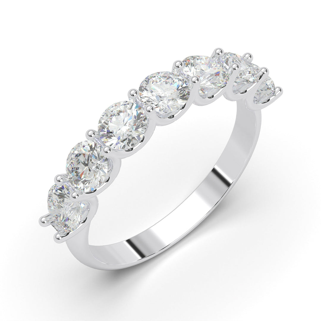 a white gold ring with five stones