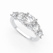 a three stone engagement ring with three diamonds