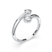 a white gold ring with two diamonds on it