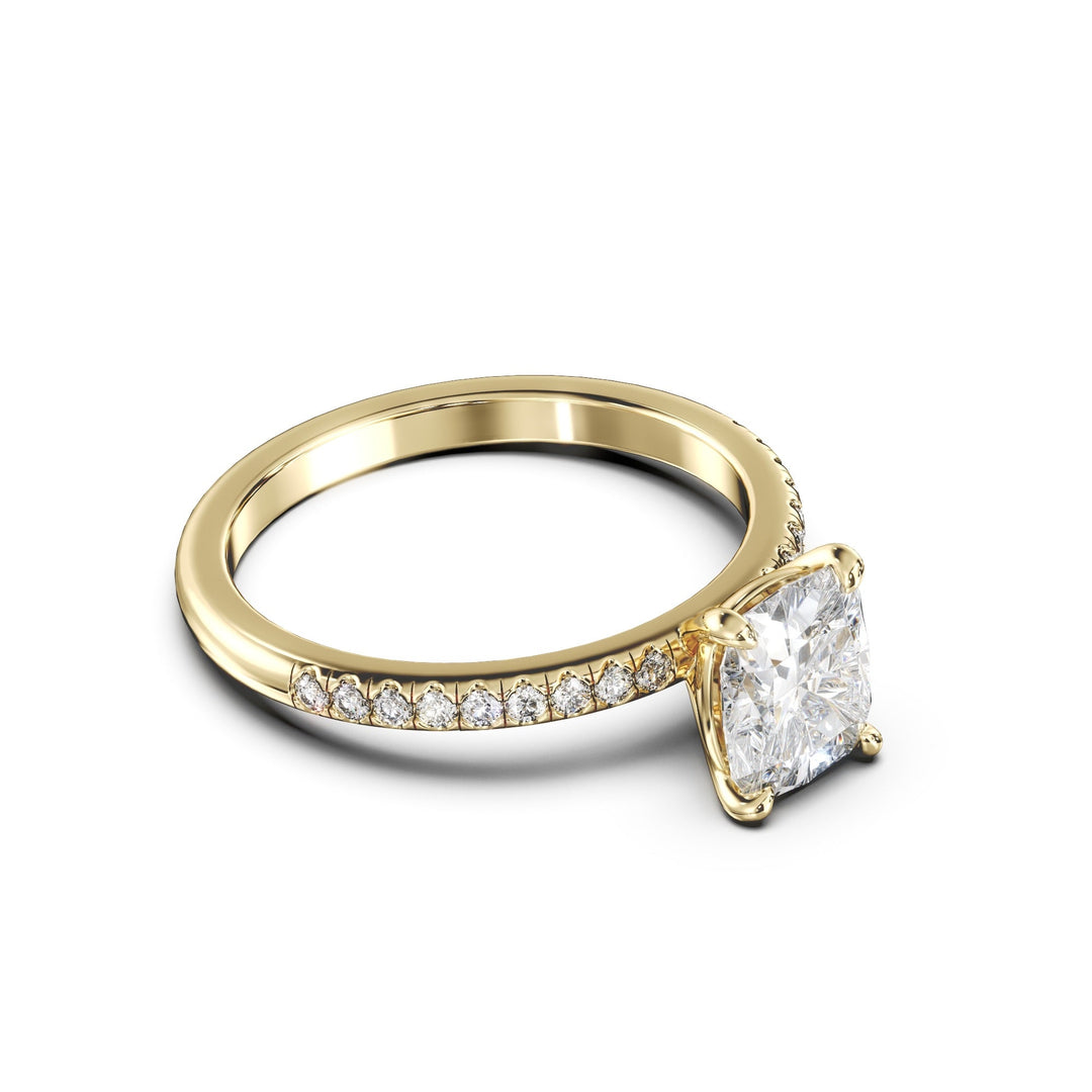 a yellow gold ring with a single diamond