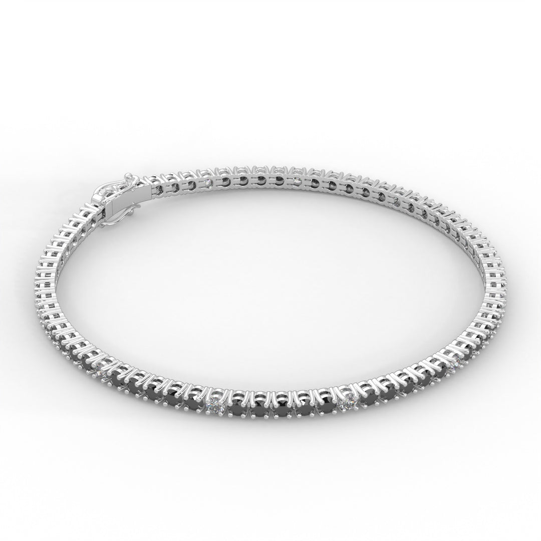 A silver bracelet with a row of small diamonds along the edge.