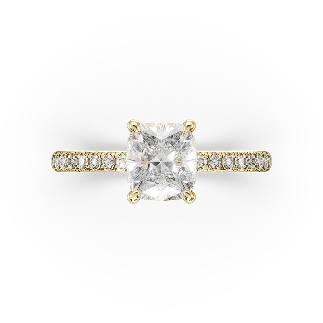 a yellow gold ring with a princess cut diamond
