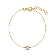 a gold bracelet with a diamond on it